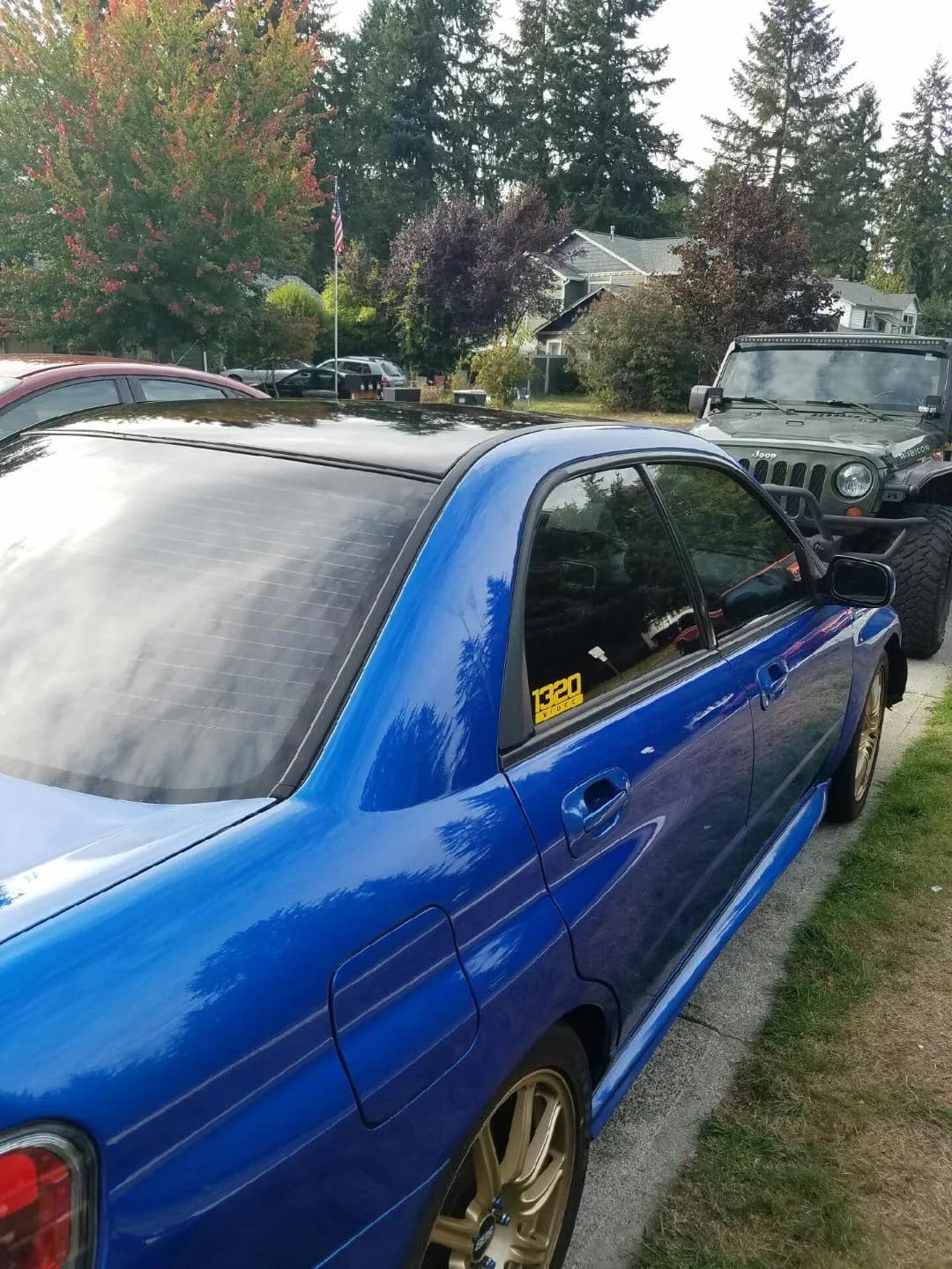 Sedan wrapped in bright blue color-change vinyl